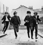 The Beatles attempt to flee from their screaming fans in "A Hard Day's Night"